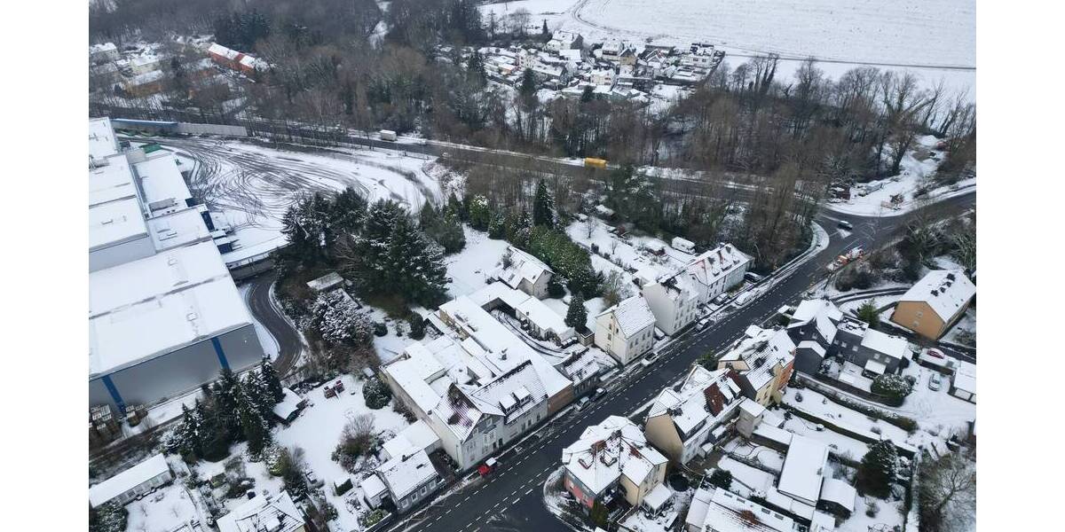 Baugrundstück mit mehreren Wohn- und Gewerbebestandsgebäuden zimmer